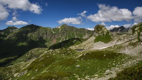Timelapse of clouds over green mountain valley in summer Stock-Footage 88174519