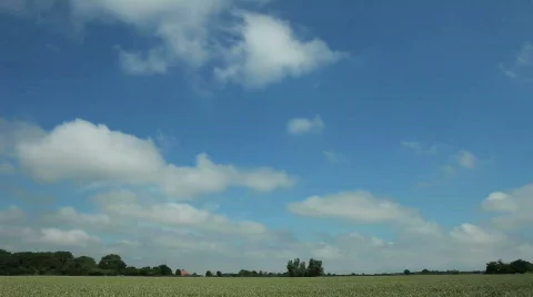 Timelapse clouds over green wheat field 1 Stock Footage 457939