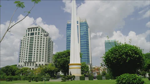 Timelapse of clouds over modern office buildings in Yangon, Myanmar Stock Footage 33625456