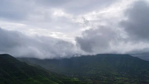 Timelapse - Clouds over a mountain during rainy season 4K60 Stock Footage 268971011