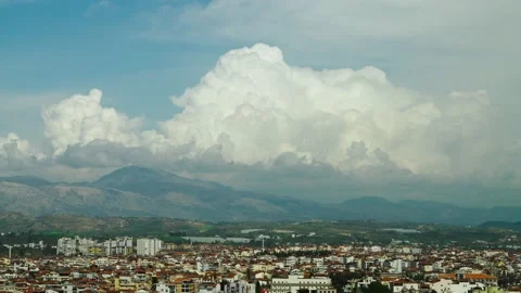 Timelapse of clouds over the mountains against a blue sky Stock Footage 239547454