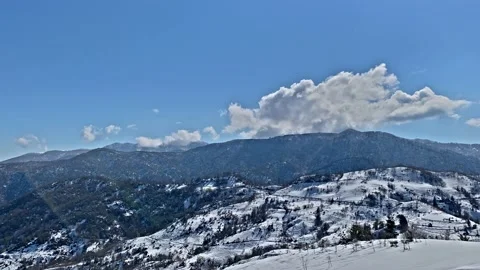 Timelapse clouds over mountains in winter Stock Footage 164089501