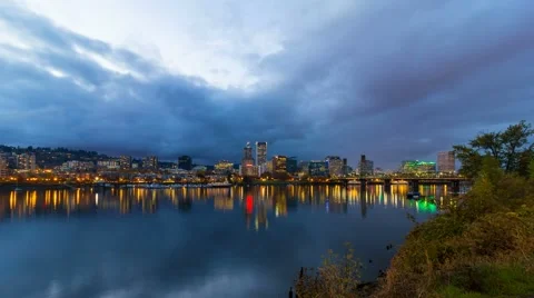 Timelapse of clouds over Portland OR skyline along Willamette River at blue hour Stock Footage 56862271
