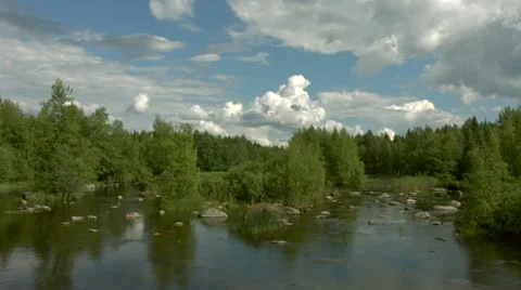 Timelapse of clouds over a river Stock Footage 49686223