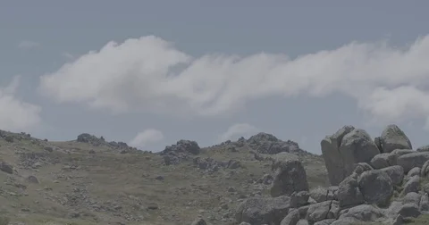 Timelapse of clouds over rocky hill Video stock 73490201