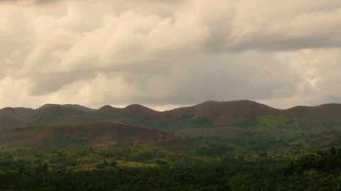 Timelapse of Clouds over rolling patchwork hills and fading to night Stock Footage 104655428