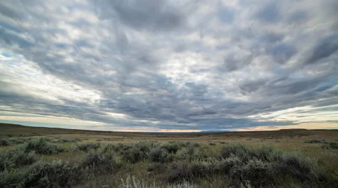 Timelapse clouds over sagebrush at sunset Stock Footage 62259314