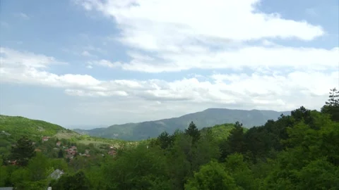 Timelapse with clouds over a small mountain village. Stock Footage 130389971