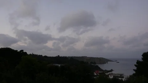 Timelapse clouds over St Brelade's Bay, Jersey in the Channel Islands Video stock 82156167