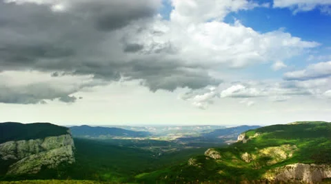 Timelapse clouds over the valley in FullHD Stock Footage 24685772