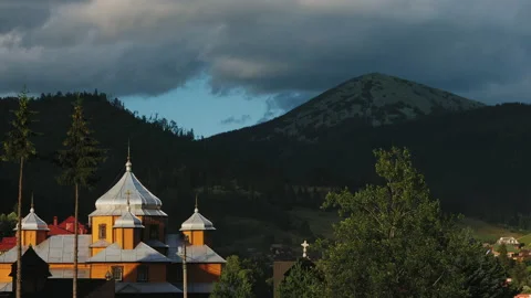Timelapse of clouds over the village between the mountains Stock Footage 138927570
