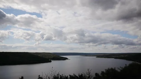 Timelapse of clouds over the water stream of Dniester river in a countryside of Stock Footage 162877793