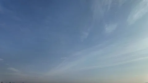 Timelapse of clouds painting patterns in blue sky canvas Stock Footage 300468914