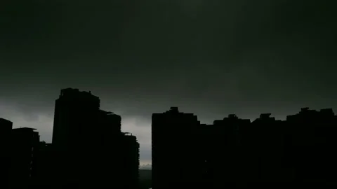 Timelapse. Clouds pass over apartment buildings tops. Rain starts, sky get's Stock Footage 148477059