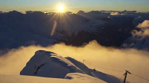 Timelapse of clouds passing by mountain top with cablecar in front Stock Footage 102170714