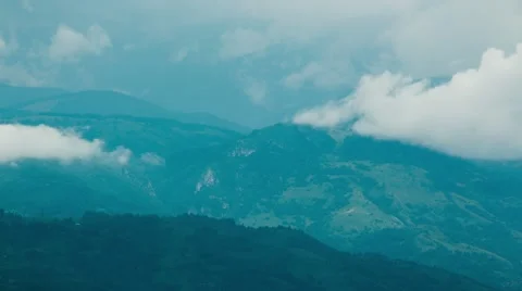 Timelapse of Clouds Passing by the Mountains Stock Footage 67988027
