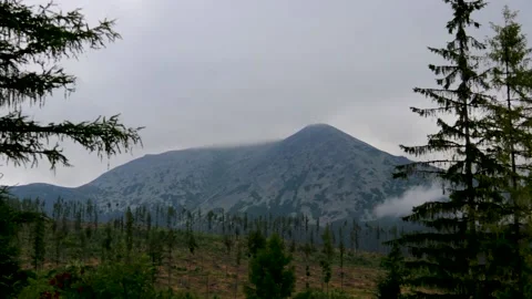 Timelapse of clouds passing in the mountains Stock Footage 152976061