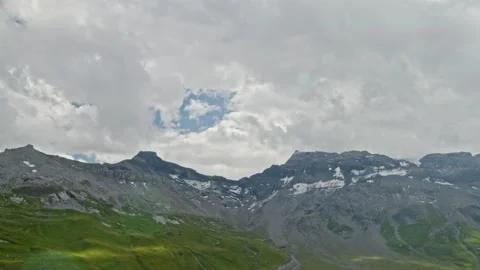 Timelapse of clouds passing mountains. Stormy clouds touches mountain peaks.  Video stock 144449505