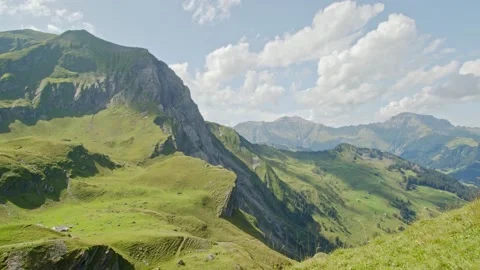 Timelapse of clouds passing mountains. View from Engstligenalp in Adelboden.  Video stock 144449237