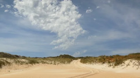 Timelapse of Clouds passing over 4x4 sand dune Stock Footage 61420146