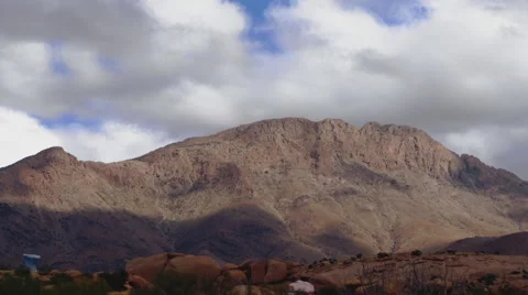 Timelapse clouds passing over a Atlas mountain in Morocco 動画素材 68973700