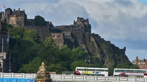 Timelapse of clouds passing over Edinburgh Castle with North Bridge Stock Footage 78766975
