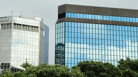 Timelapse of clouds passing over glass reflective buildings Stock Footage 89892834