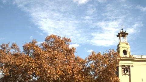 Timelapse of clouds passing over a historic building in the Monjuict Stock Footage 125355934