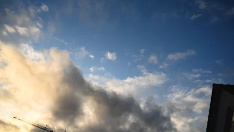 Timelapse of clouds passing over a house Stock Footage 124680627