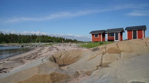 Timelapse of clouds passing over iconic beach shacks in Hanko, Finland Stock Footage 91366216