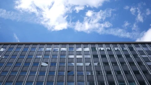 Timelapse of clouds passing over modern apartment building in downtown city Stock Footage 80868142