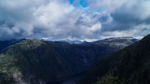 Timelapse of clouds passing over mountain tops Stock Footage 136526932