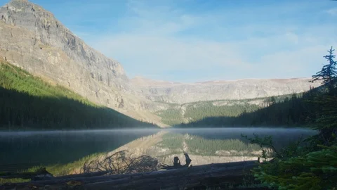 Timelapse of clouds passing over mountains and lake in the wilderness of Banff N Stock Footage 99270104