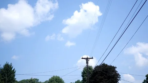 Timelapse of clouds passing over power lines Stock Footage 92271565