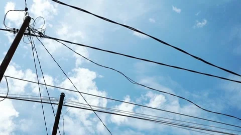 Timelapse of clouds passing over power lines. Stock Footage 264108003