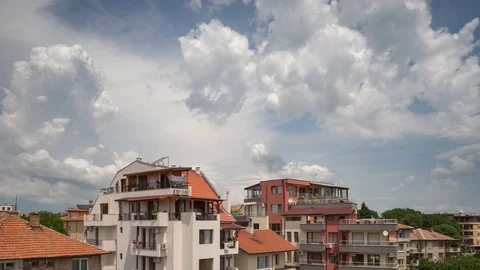 Timelapse of clouds passing over residential apartment building Stock Footage 91365979