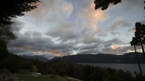 Timelapse of clouds passing over Villa Pidertupo in Traful Stock Footage 86999378