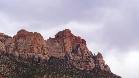 Timelapse of Clouds Passing Over the Zion's Towering Sandstone Cliffs Stock Footage 258160229