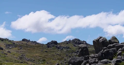 Timelapse of clouds passing rocky hill 스톡 동영상 73490198