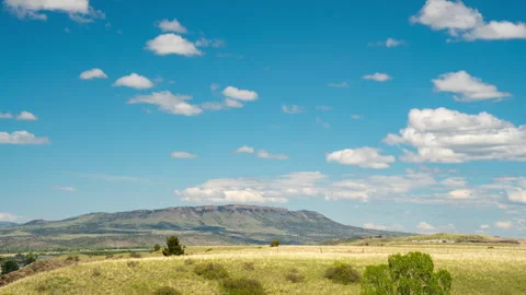 Timelapse Clouds race over Sheep Mountain in Montana spring Stock Footage 310051163