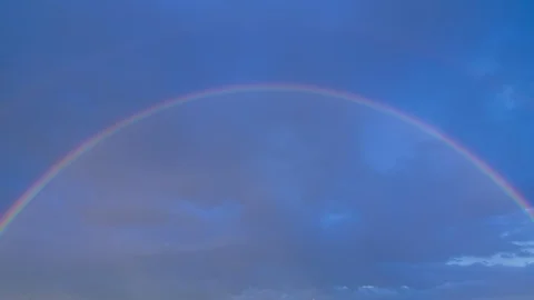 Timelapse of clouds with a rainbow 4K Stock-Footage 93829792