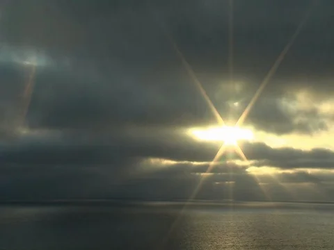 Timelapse of clouds, rays of light and the ocean. Stock Footage 113656554