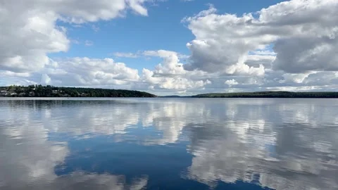 Timelapse of Clouds Reflecting on Calm Lake Sigtunafjarden Stock Footage 346408064
