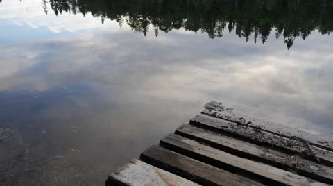 Timelapse of clouds reflecting on a lake in Canada Stock Footage 68933636