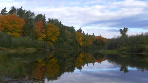 Timelapse of clouds, river and fall colors in Canada Stock Footage 159203844