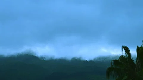 Timelapse: clouds roll over the tops of the hills on a very stormy day Stock Footage 201078122