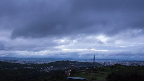 Timelapse - Clouds rolling over the city 4K30 Stock Footage 271078888