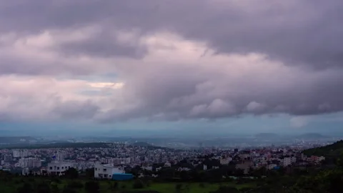 Timelapse - Clouds rolling over the city 4K60 Stock Footage 271079136