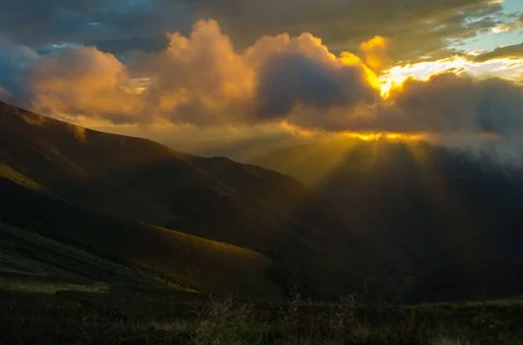 Timelapse of clouds rolling over mountains during sunset Stock Footage 93018650
