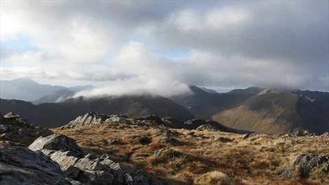 Timelapse of clouds rolling over Scottish mountains Video stock 98747679